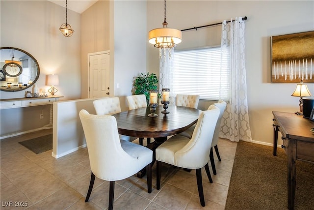 10336 Birch Bluff Ln, Las Vegas, NV 89145 - dining area with a towering ceiling, tile patterned flooring, and baseboards
