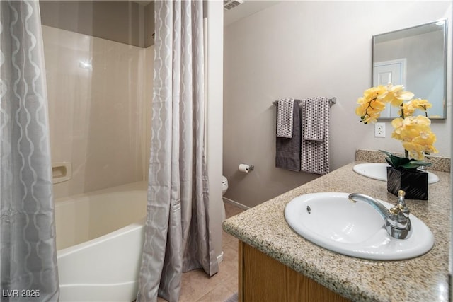 10336 Birch Bluff Ln, Las Vegas, NV 89145 - bathroom with double vanity, tile patterned floors, toilet, shower / tub combo with curtain, and baseboards