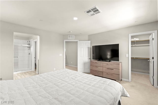160 Lomita Heights Dr, Las Vegas, NV 89138 - bedroom featuring a spacious closet, a closet, light carpet, and ensuite bath