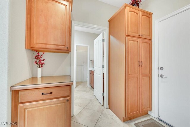 hallway with light tile patterned flooring