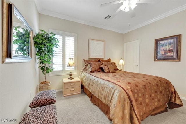 bedroom with light carpet, baseboards, crown molding, and a ceiling fan