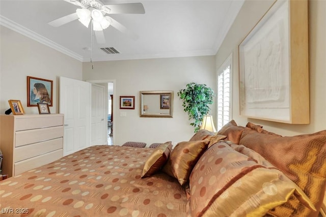 bedroom with ornamental molding and ceiling fan