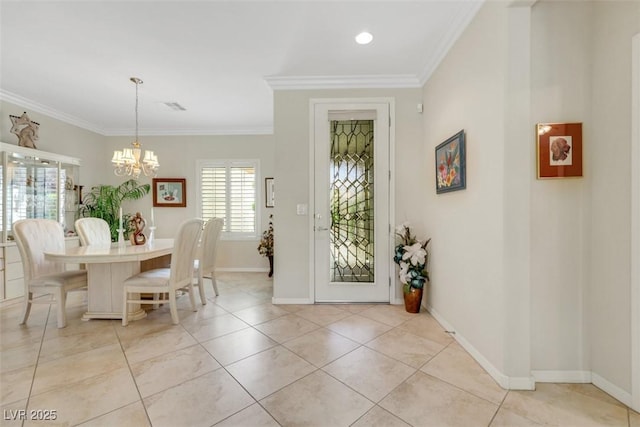 dining area with ornamental molding, a chandelier, baseboards, and light tile patterned floors