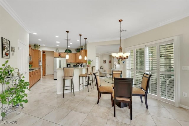 dining space featuring a chandelier, crown molding, light tile patterned floors, recessed lighting, and baseboards