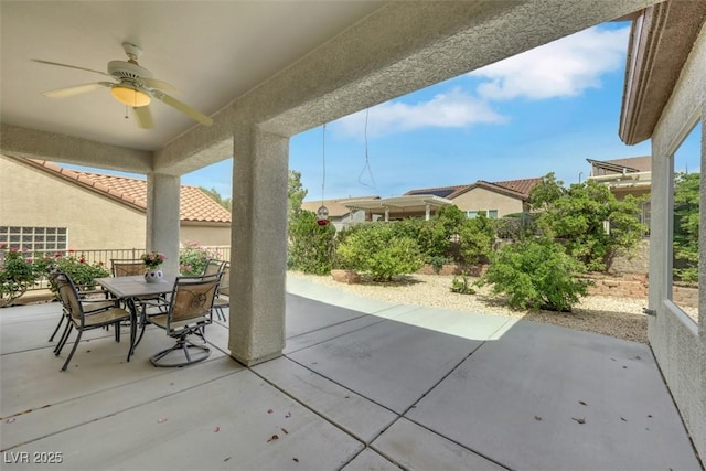 view of patio / terrace with outdoor dining space, ceiling fan, and a fenced backyard