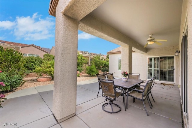 view of patio featuring ceiling fan and outdoor dining area