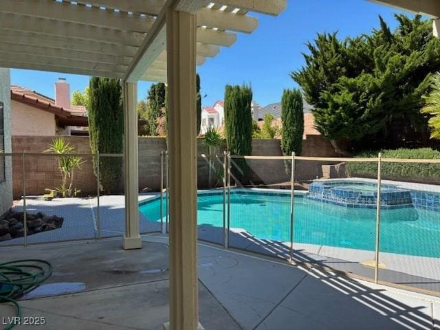 view of pool featuring a fenced backyard, a pool with connected hot tub, a patio, and a pergola