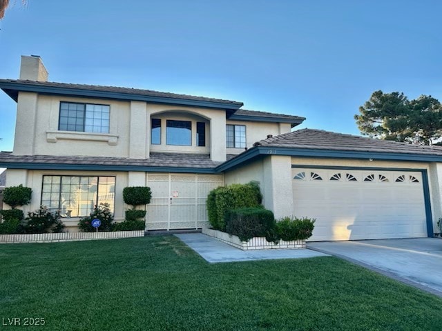 view of front of property featuring driveway, a chimney, a front lawn, and stucco siding