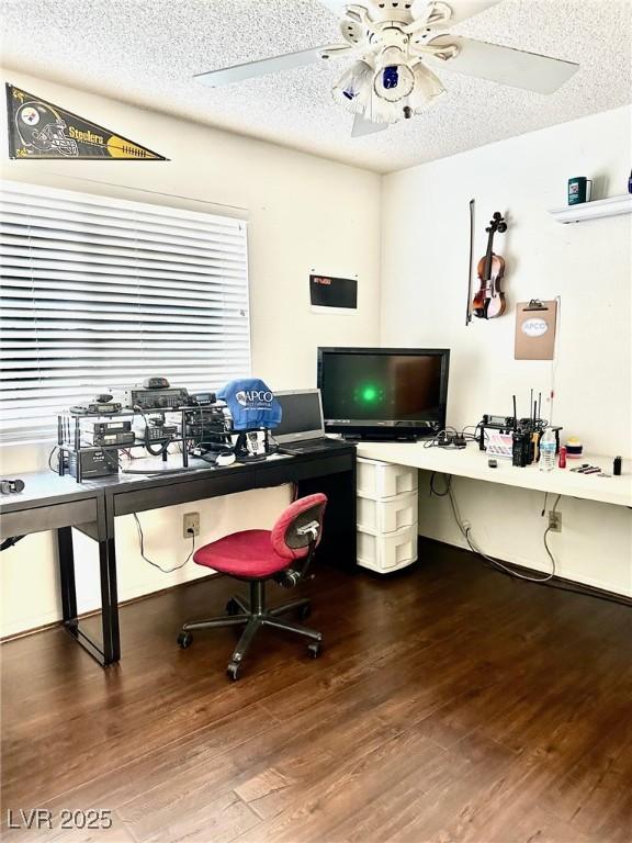 office space featuring a textured ceiling, wood finished floors, and a ceiling fan