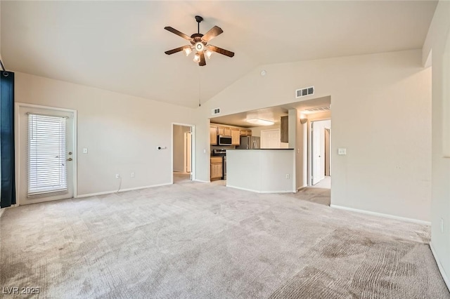 unfurnished living room with ceiling fan, light colored carpet, baseboards, and high vaulted ceiling