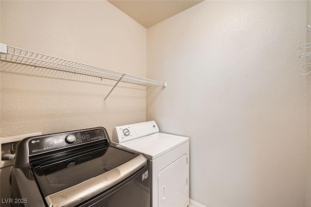 washroom featuring independent washer and dryer