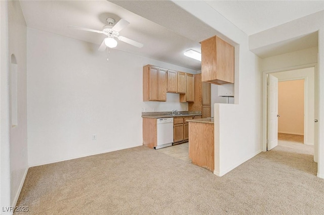 kitchen with white dishwasher, light carpet, ceiling fan, and a sink