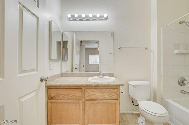 full bath with toilet,  shower combination, vanity, and tile patterned flooring