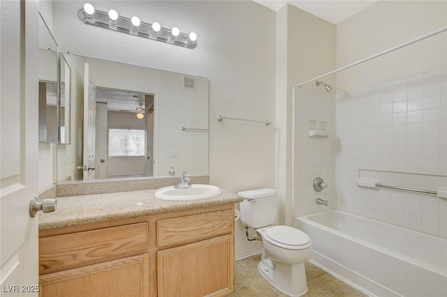 full bath with toilet, vanity, tile patterned floors, and shower / bath combination