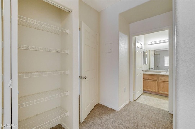 bathroom with vanity and baseboards
