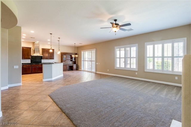 7434 Eggshell Dr, North Las Vegas, NV 89084 - unfurnished living room featuring light tile patterned flooring, baseboards, ceiling fan, and recessed lighting