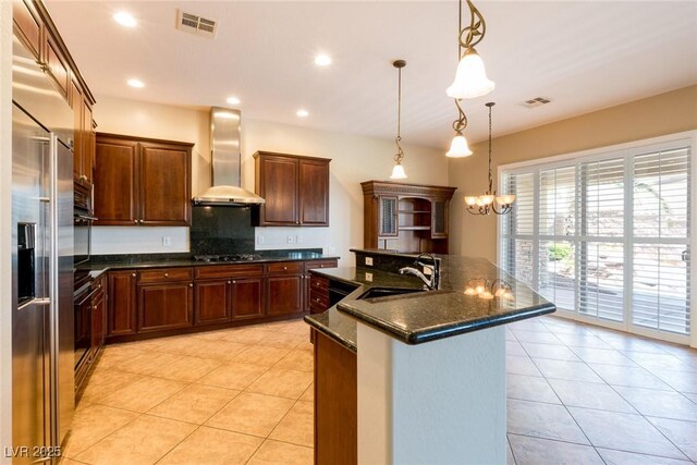 7434 Eggshell Dr, North Las Vegas, NV 89084 - kitchen with wall chimney exhaust hood, a sink, light tile patterned floors, gas stovetop, and recessed lighting
