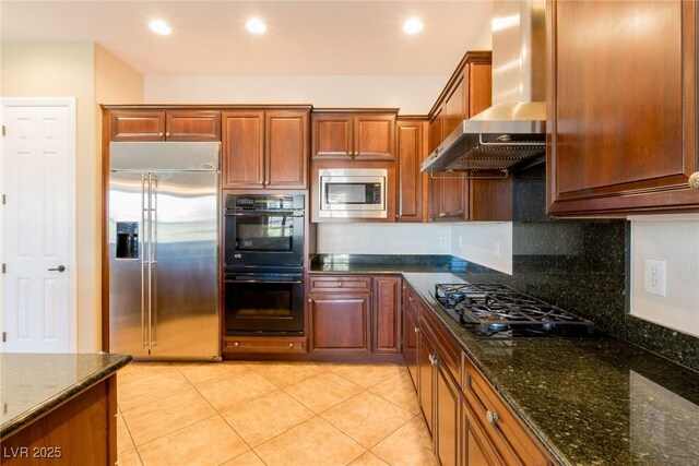 7434 Eggshell Dr, North Las Vegas, NV 89084 - kitchen featuring black appliances, wall chimney exhaust hood, tasteful backsplash, dark stone counters, and light tile patterned floors