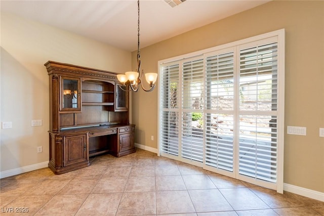 7434 Eggshell Dr, North Las Vegas, NV 89084 - unfurnished dining area featuring a chandelier, baseboards, and light tile patterned flooring