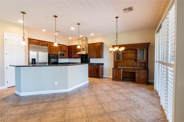 7434 Eggshell Dr, North Las Vegas, NV 89084 - kitchen with built in appliances, dark countertops, extractor fan, hanging light fixtures, and recessed lighting