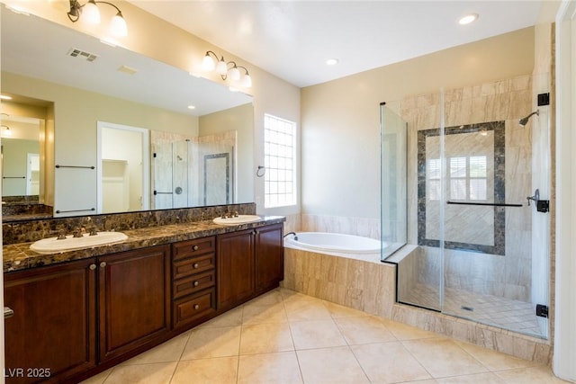 7434 Eggshell Dr, North Las Vegas, NV 89084 - bathroom with a shower stall, a garden tub, tile patterned flooring, and double vanity