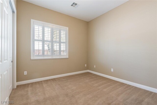 7434 Eggshell Dr, North Las Vegas, NV 89084 - spare room featuring light carpet and baseboards