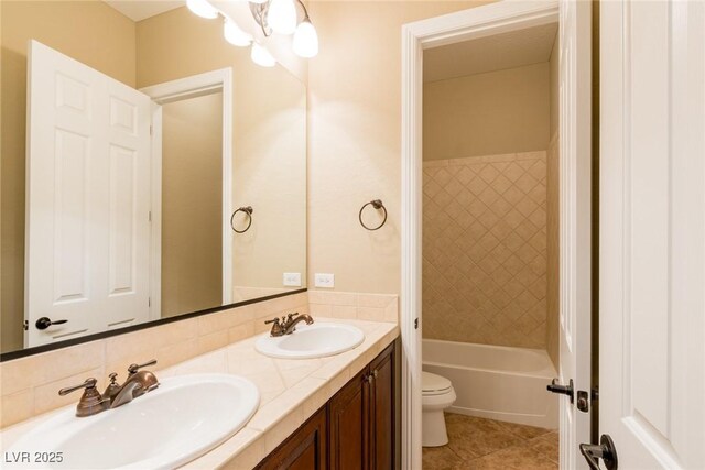 7434 Eggshell Dr, North Las Vegas, NV 89084 - full bath with toilet, double vanity, tile patterned floors, and  shower combination