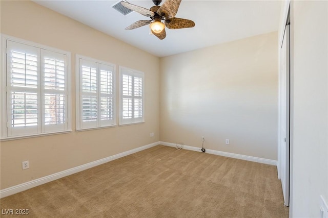 7434 Eggshell Dr, North Las Vegas, NV 89084 - empty room featuring ceiling fan, light colored carpet, and baseboards