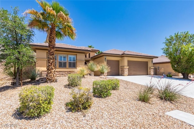 7434 Eggshell Dr, North Las Vegas, NV 89084 - view of front of house featuring stucco siding, stone siding, and an attached garage