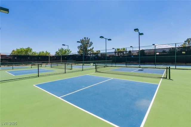 7434 Eggshell Dr, North Las Vegas, NV 89084 - view of tennis court featuring fence and community basketball court