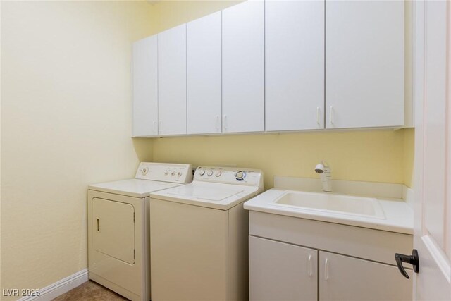 7434 Eggshell Dr, North Las Vegas, NV 89084 - washroom featuring cabinet space and separate washer and dryer