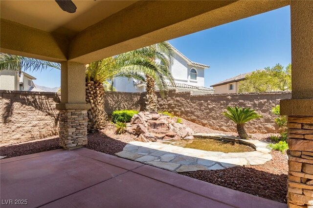 7434 Eggshell Dr, North Las Vegas, NV 89084 - view of patio featuring a fenced backyard and a ceiling fan