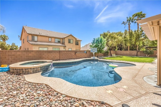 view of swimming pool with a pool with connected hot tub and a patio area