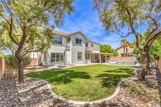 back of property featuring a patio and stucco siding