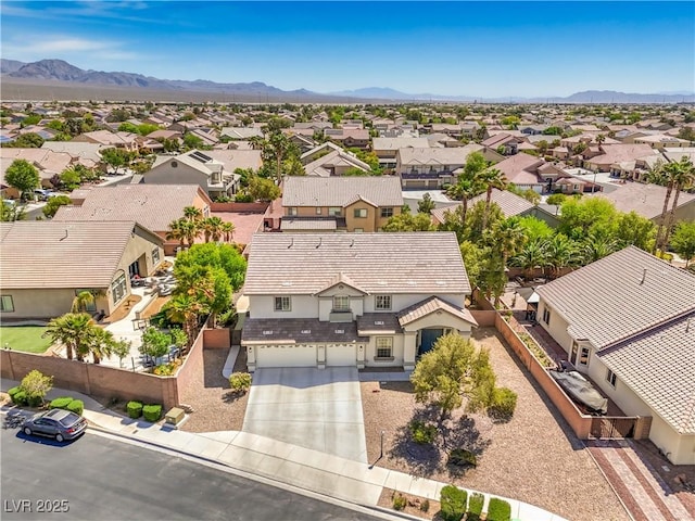 aerial view of residential area with a mountain backdrop