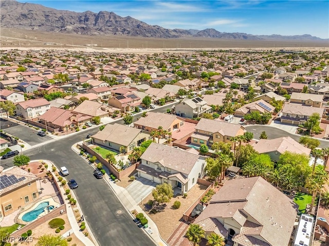aerial view of residential area with a mountain backdrop