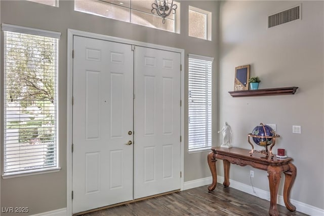 entrance foyer with wood finished floors and baseboards