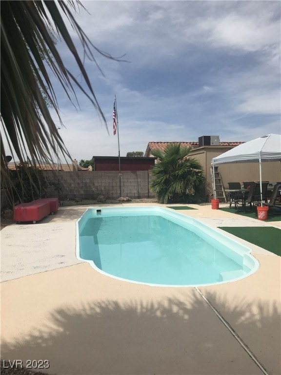 view of swimming pool with a patio, a fenced backyard, and a gazebo