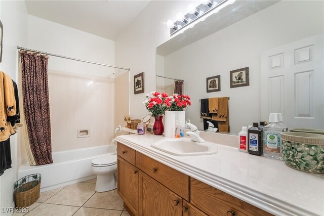 bathroom featuring tile patterned floors, vanity, shower / bath combination with curtain, and toilet