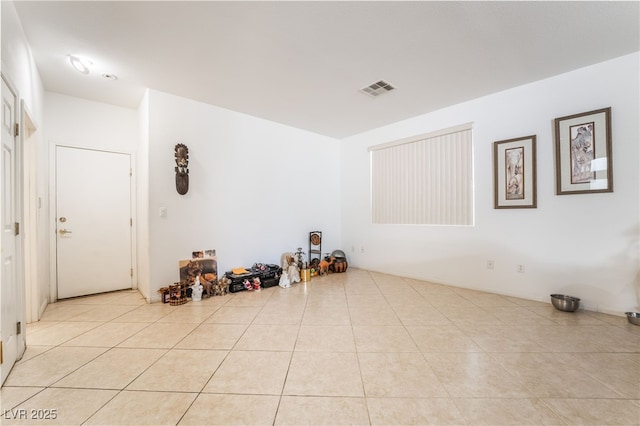 empty room with light tile patterned floors