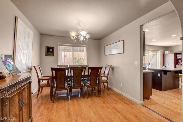 9065 W Torino Ave, Las Vegas, NV 89148 - dining room with light wood finished floors, baseboards, and a chandelier