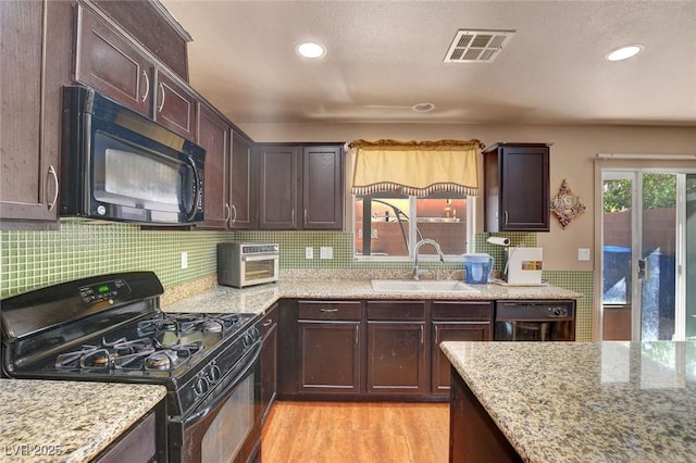 9065 W Torino Ave, Las Vegas, NV 89148 - kitchen with black appliances, a sink, light wood-type flooring, light stone counters, and dark brown cabinetry