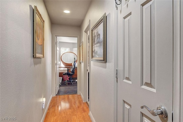 9065 W Torino Ave, Las Vegas, NV 89148 - hallway with light wood-type flooring, baseboards, and an office area