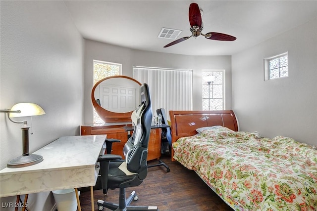9065 W Torino Ave, Las Vegas, NV 89148 - bedroom with multiple windows, wood finished floors, a desk, and ceiling fan