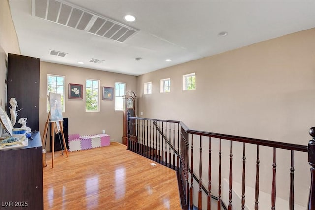 9065 W Torino Ave, Las Vegas, NV 89148 - hallway with an upstairs landing, wood finished floors, recessed lighting, and healthy amount of natural light