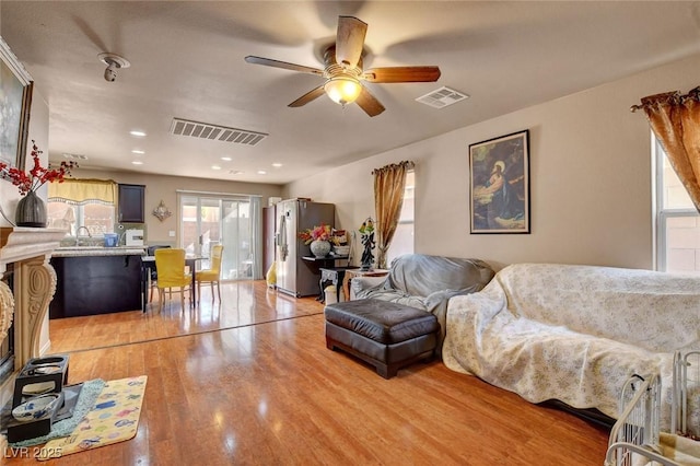 9065 W Torino Ave, Las Vegas, NV 89148 - living room with light wood-type flooring and ceiling fan