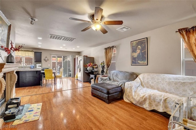 9065 W Torino Ave, Las Vegas, NV 89148 - living area with light wood-style floors and a ceiling fan