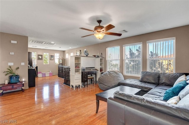 9065 W Torino Ave, Las Vegas, NV 89148 - living room with ceiling fan and light wood-style flooring