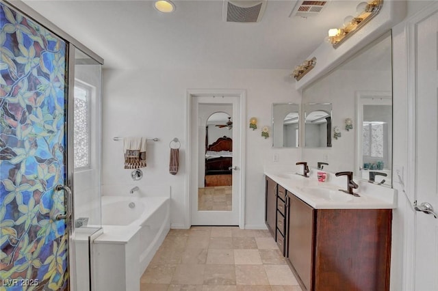 9065 W Torino Ave, Las Vegas, NV 89148 - ensuite bathroom featuring a garden tub, double vanity, curtained shower, and baseboards