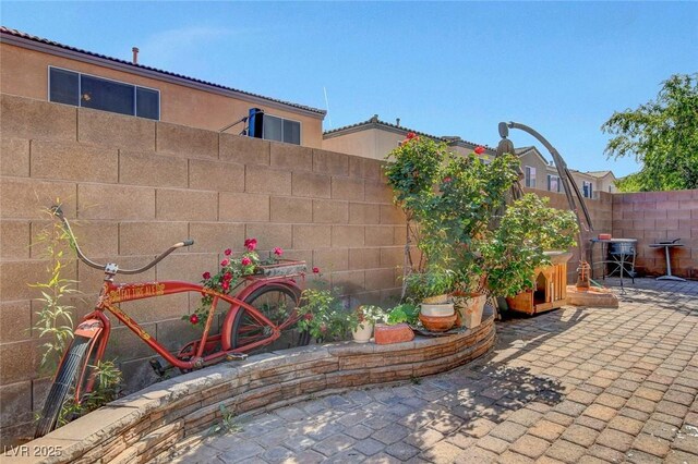 9065 W Torino Ave, Las Vegas, NV 89148 - fenced backyard with a patio area
